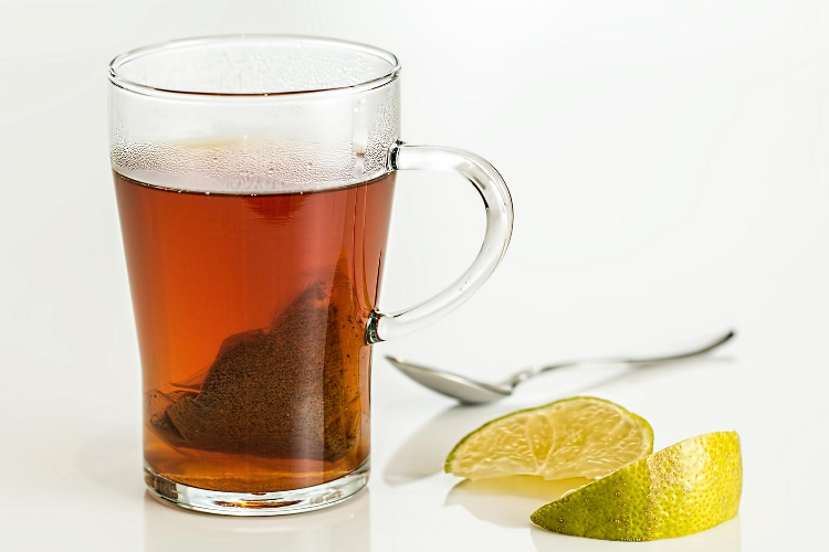 all day slimming tea close up with limes